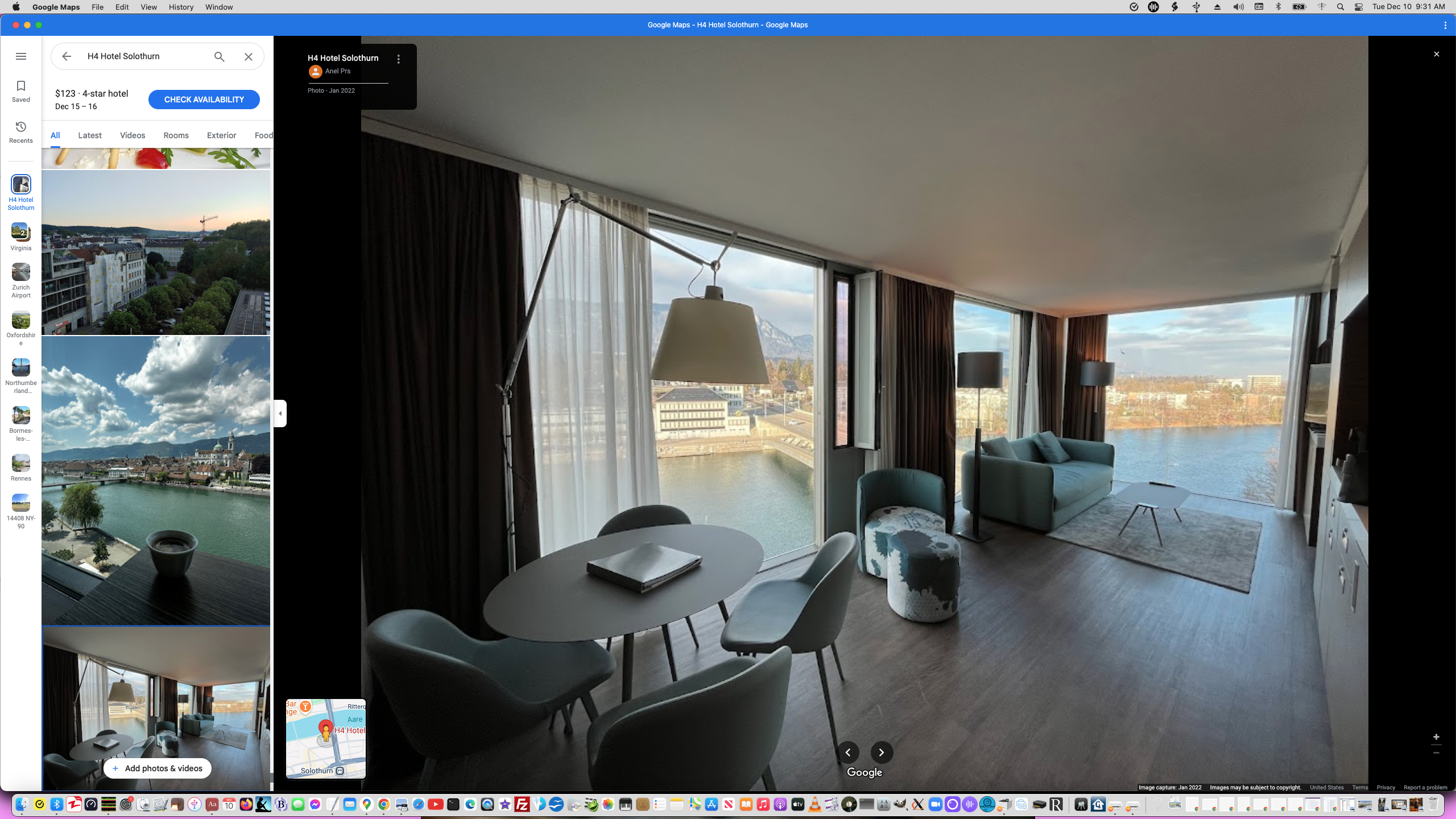 ./Screen Shot 2024-12-10 at 9.31.29 AM - H4 Solothurn Studio Interior - Living Room view towards Couch and TV with outside view and Round Table - Spartan Room - Northeast Corner towards bridge - OPEN SLIT WINDOW.png